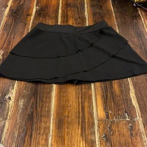 Brand new, never worn, swim skort.  Very nice, fits like a medium, black.